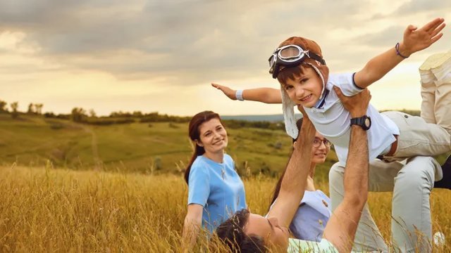 A family playing together outdoors